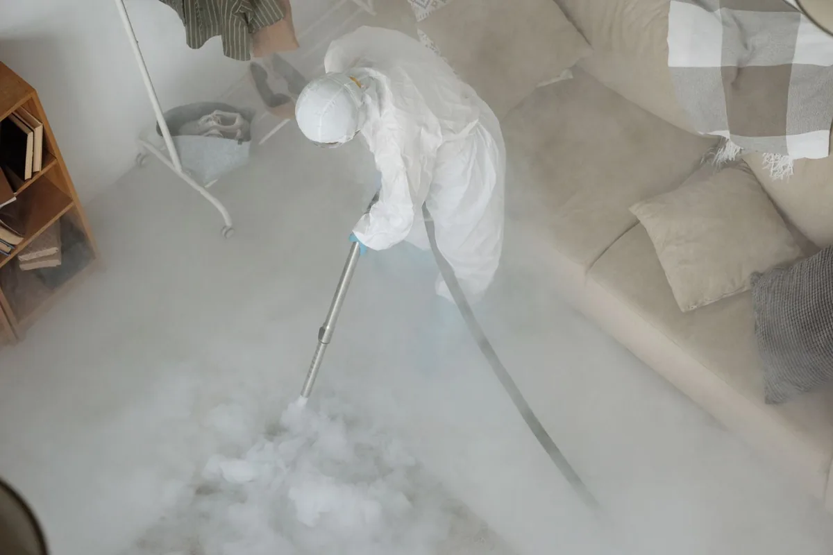 Biohazard cleanup technician in protective equipment, Dayton, OR